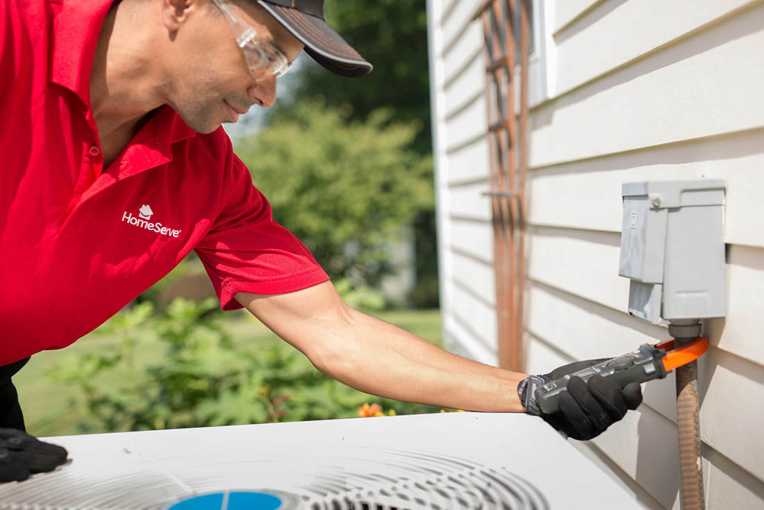 cooling-AirConditioningInstallation-Supporting-1100×734 Service technician testing the HVAC meter on the side of the house after AC installation service
