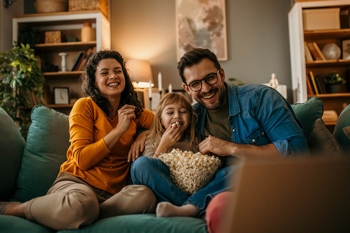 family watching a movie on the couch